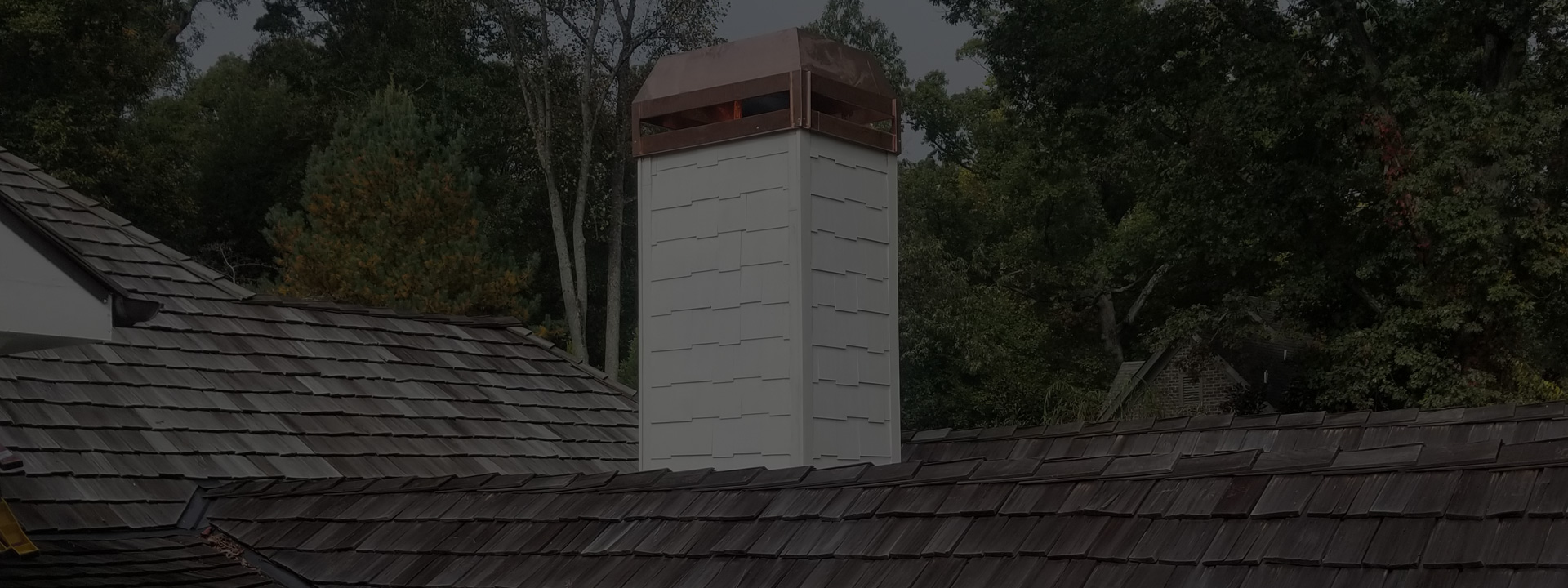 A chimney on the roof of a house.